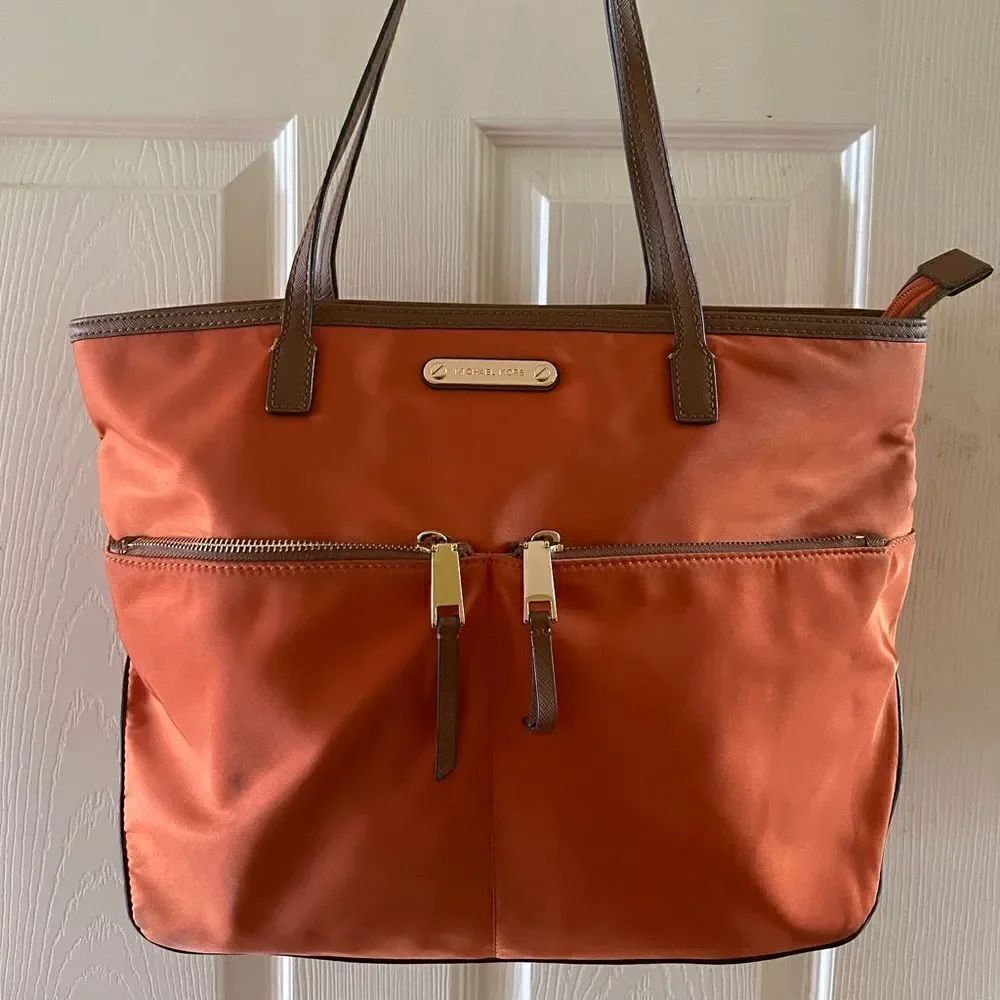 Michael Kors Orange Nylon Medium shoulder bag ,brown leather trims and straps